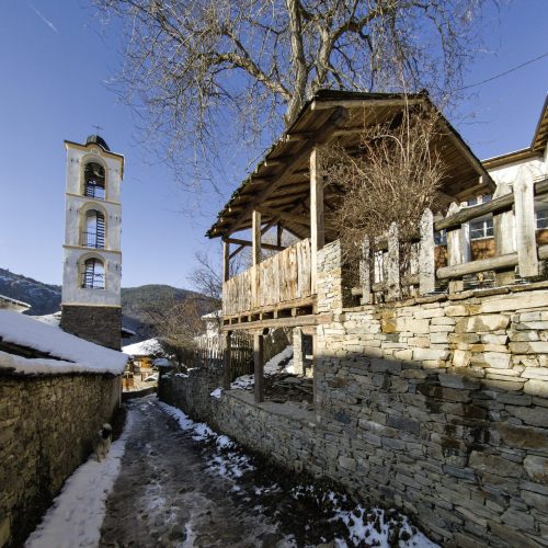 Sunset view of Village of Kovachevitsa, Bulgaria Winter Sunset view of Village of Kovachevitsa with Authentic nineteenth century houses, Blagoevgrad Region, Bulgaria